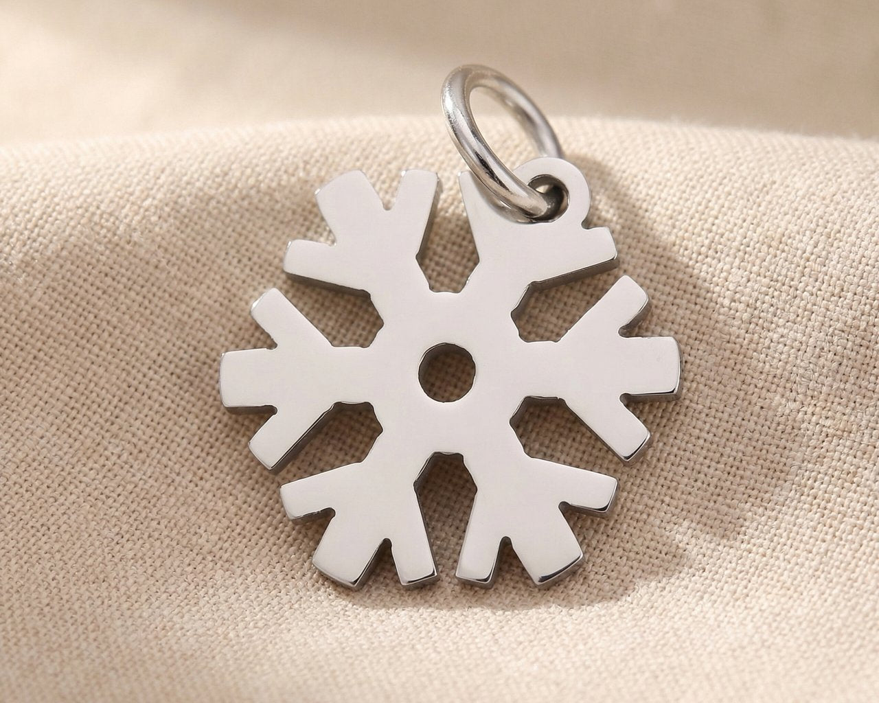 Silver snowflake charm for keyring symbolizing winter memories, uniqueness, and festive seasonal keepsakes