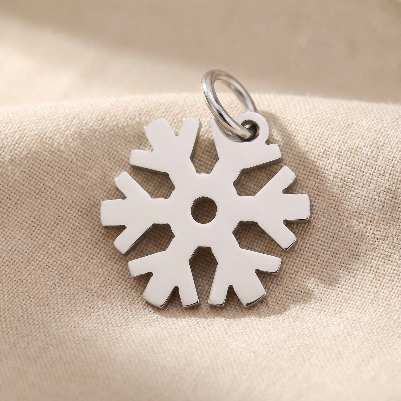 Silver snowflake charm for keyring symbolizing winter memories, uniqueness, and festive seasonal keepsakes