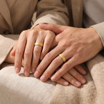 A couple wearing sparkling love ring, elegant textured band ring with engraved inner message detail