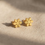 Sparkling snowflake earrings in gold with crystal detail, delicate festive jewellery gift idea