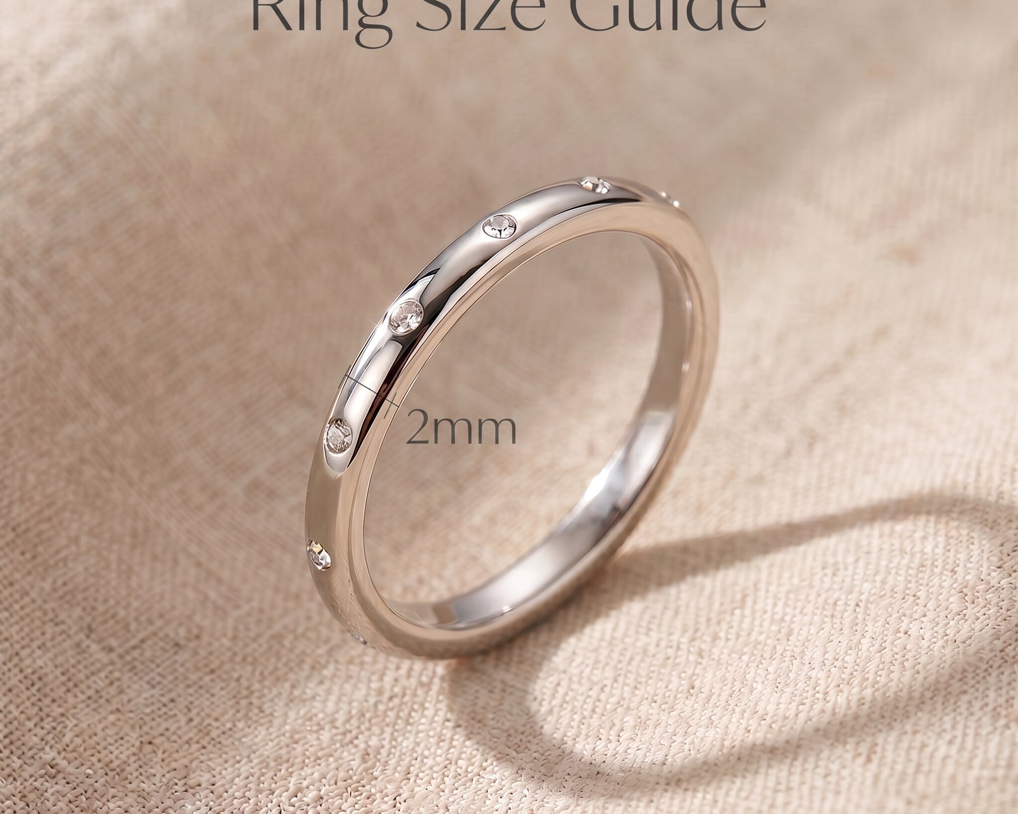 Starlets ring size guide showing slim minimalist band width and delicate stacking ring proportions
