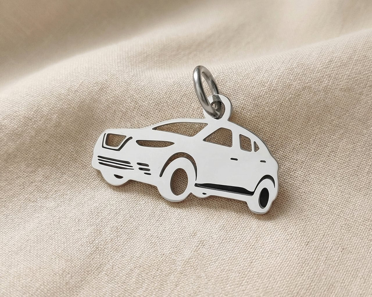 Silver SUV charm for keyring symbolizing travel adventures, family road trips, and meaningful driving memories