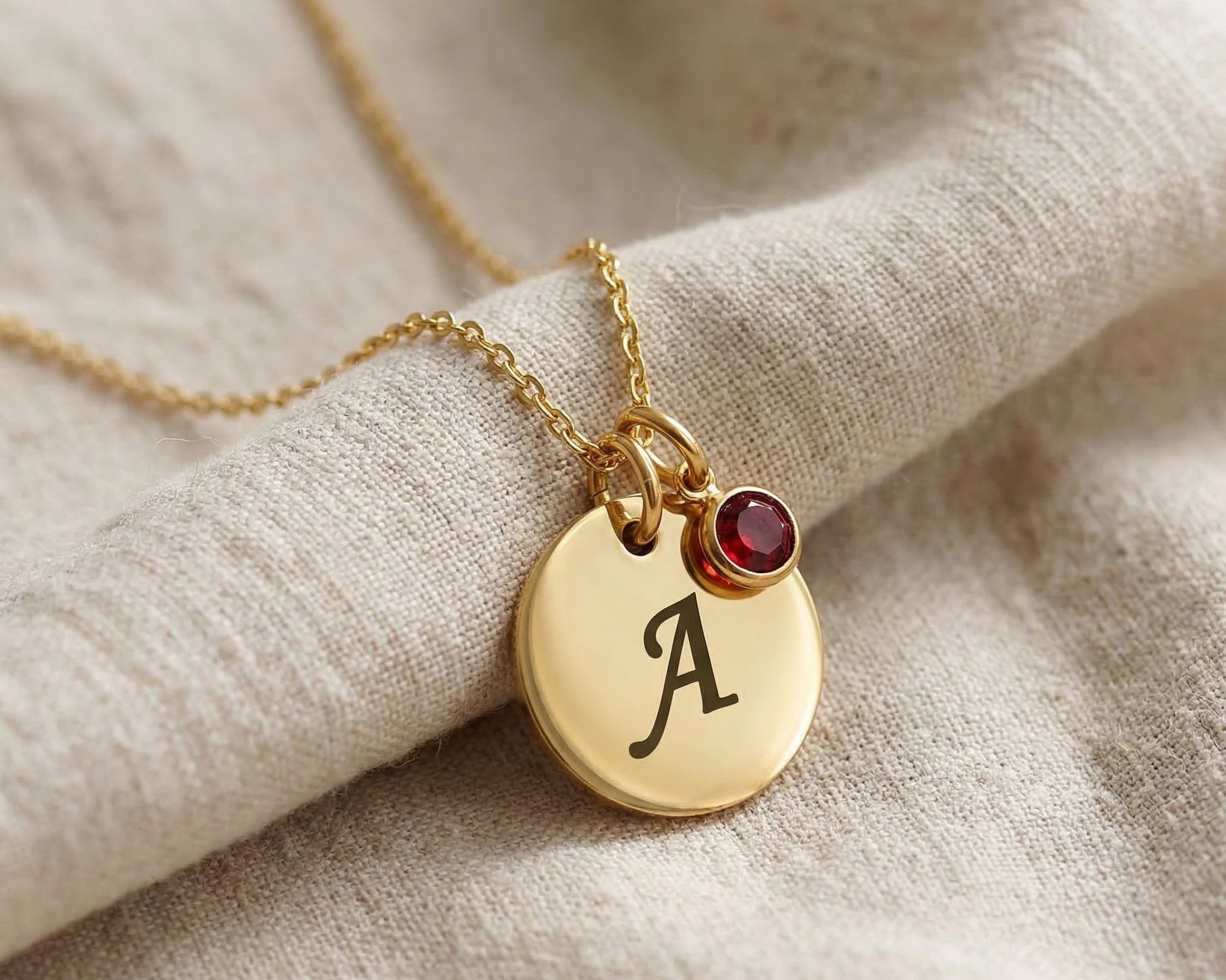 Tokens of Love Necklace in gold with initial charm and birthstone, personalised jewellery piece