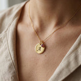 Woman wearing Tokens of Love Necklace with initial charm, personalised jewellery lifestyle image