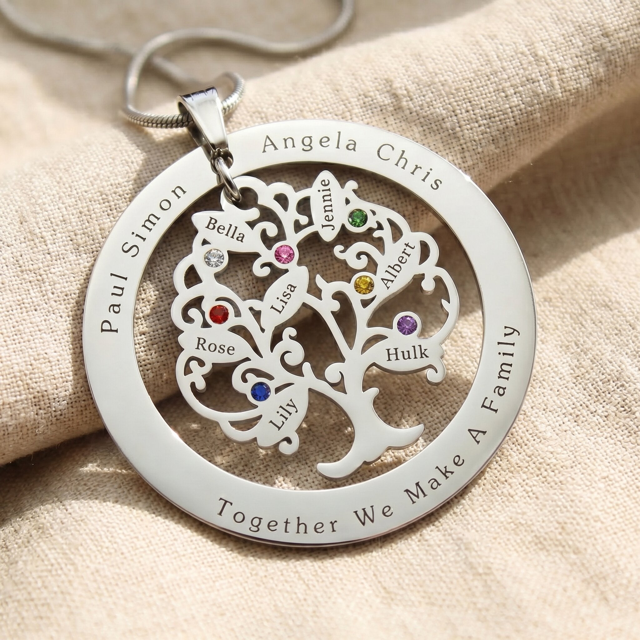 personalized tree of life necklace with engraved name on circle disc and 7 leaf design with birthstones