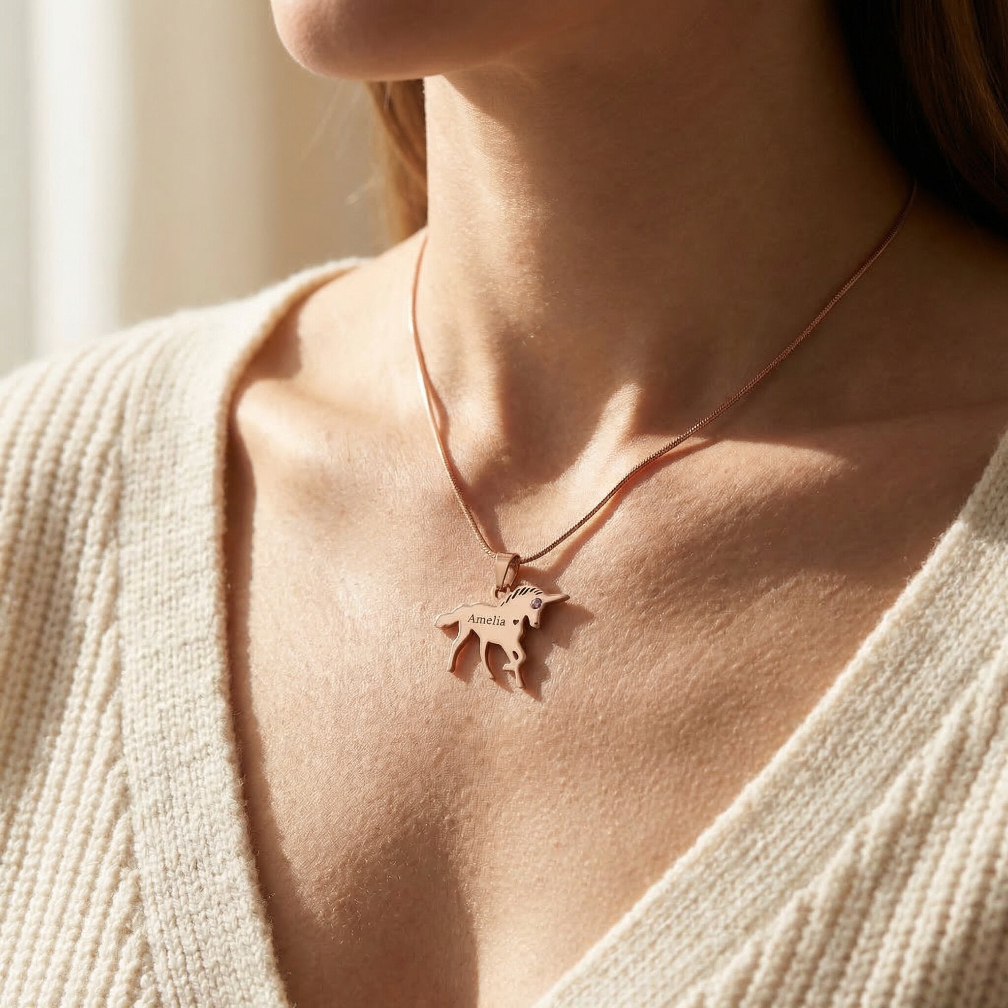 Girl wearing unicorn name necklace with personalised name, everyday kids jewellery style