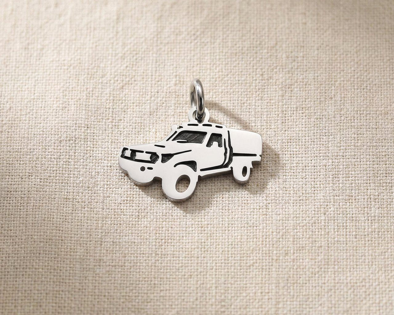 Silver ute canopy charm for keyring representing outdoor adventures, utility vehicles, and rugged lifestyle memories