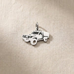 Silver ute canopy charm for keyring representing outdoor adventures, utility vehicles, and rugged lifestyle memories