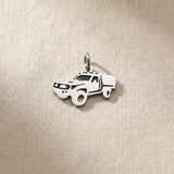 Silver ute canopy charm for keyring representing outdoor adventures, utility vehicles, and rugged lifestyle memories