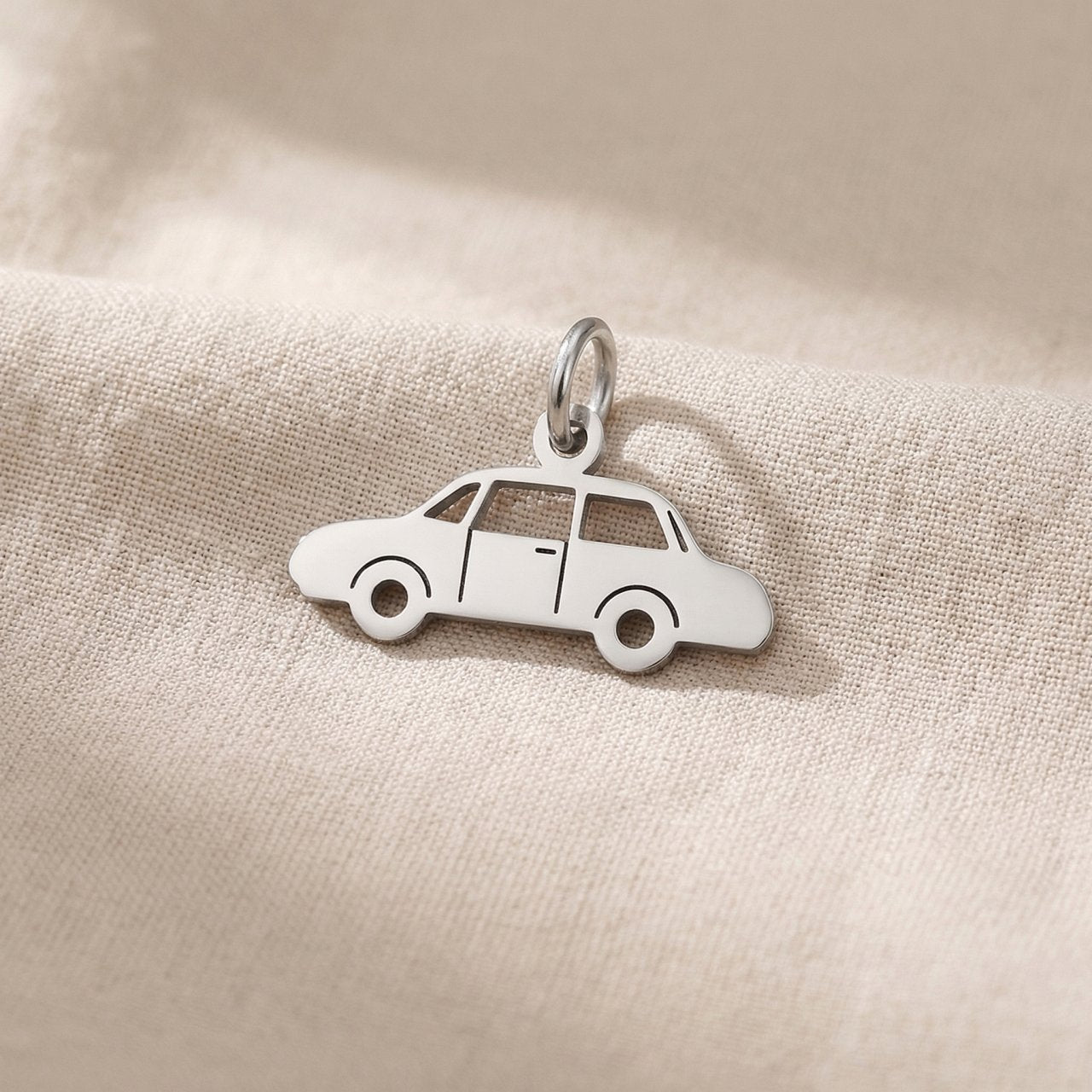 Silver vintage car charm for keyring symbolizing classic car passion, nostalgia, and timeless travel memories