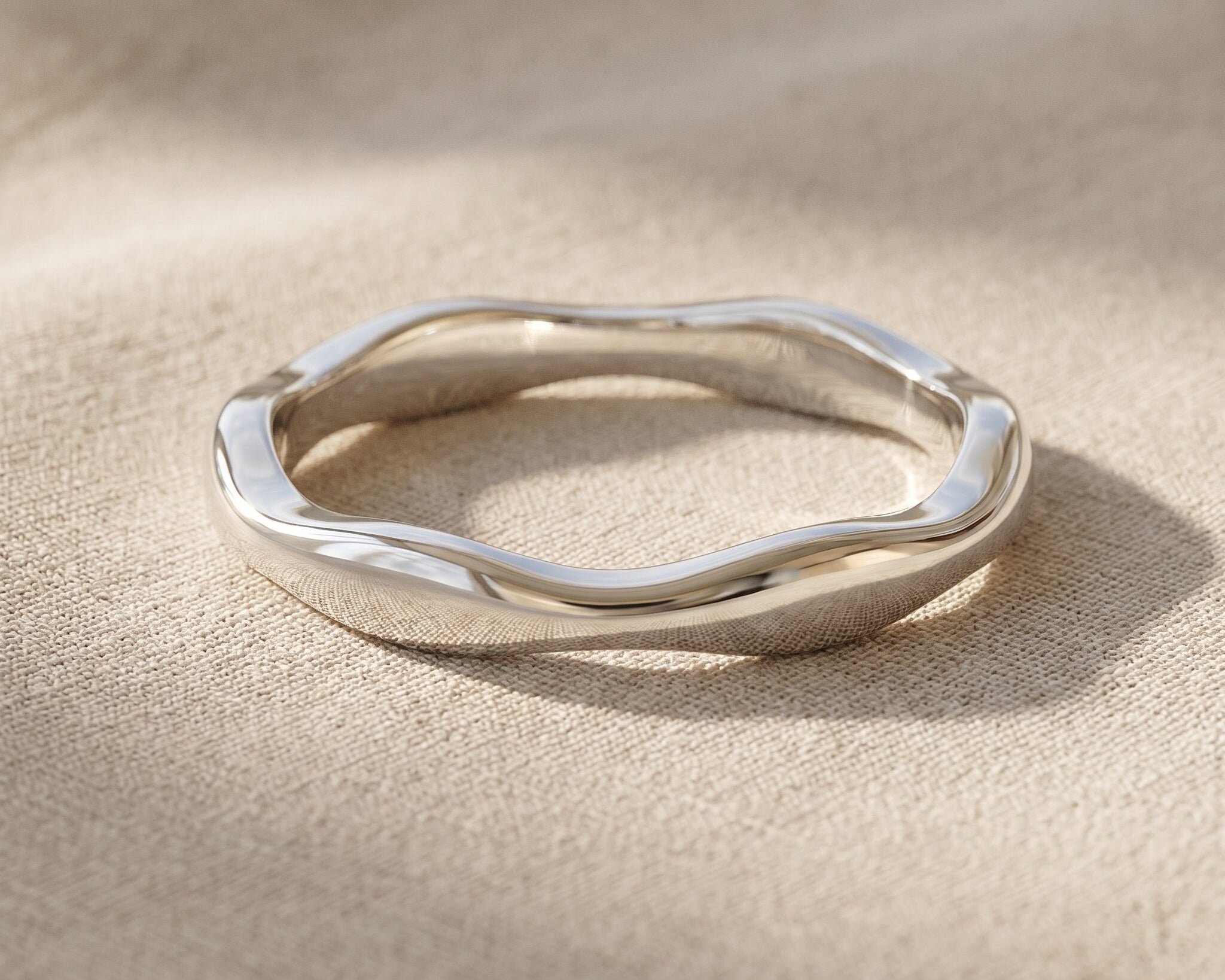 Wave band ring in silver with sculptural curved design, minimalist stacking jewellery gift for her