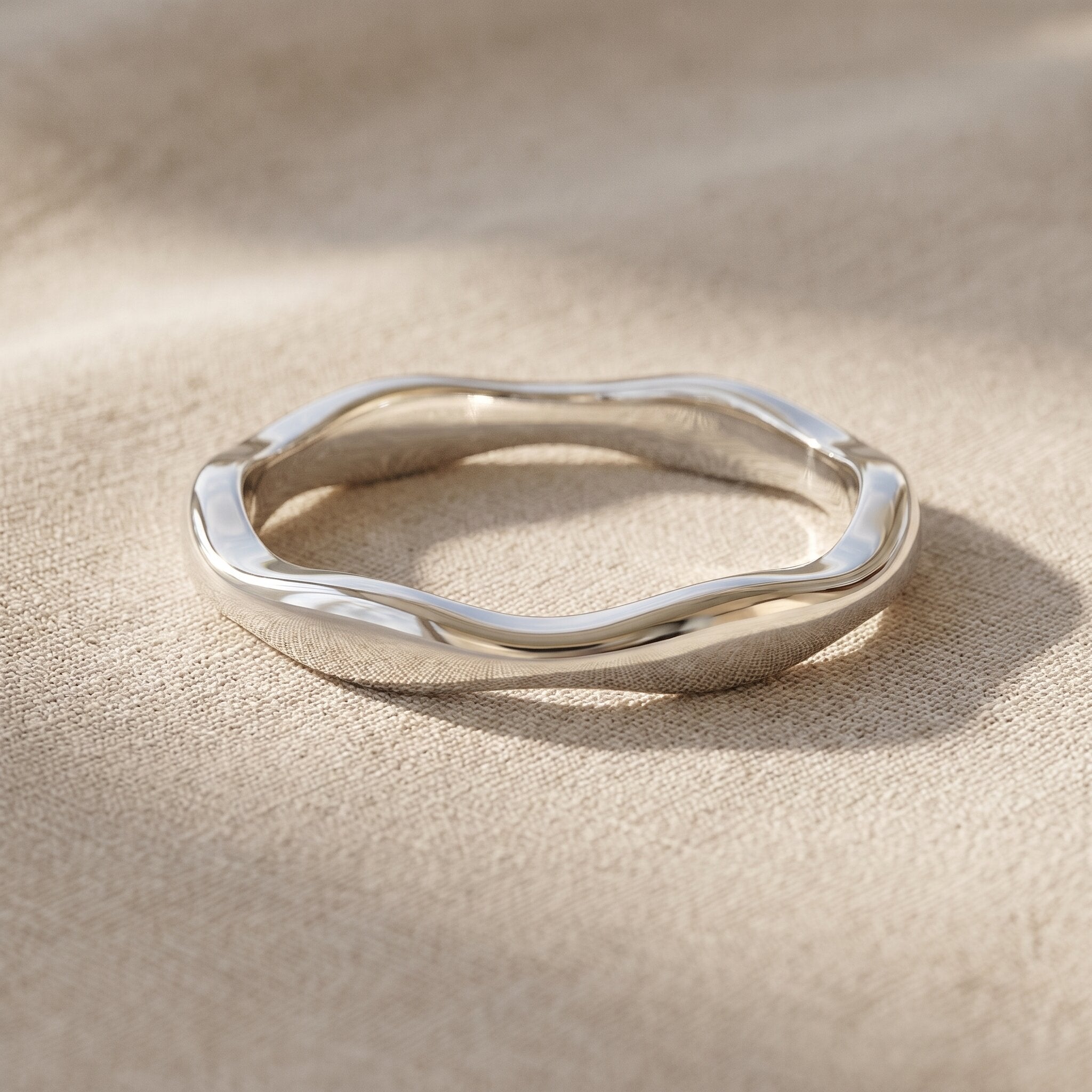 Wave band ring in silver with sculptural curved design, minimalist stacking jewellery gift for her