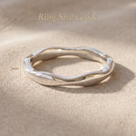 Wave band ring size guide showing curved band width and sculptural design proportions